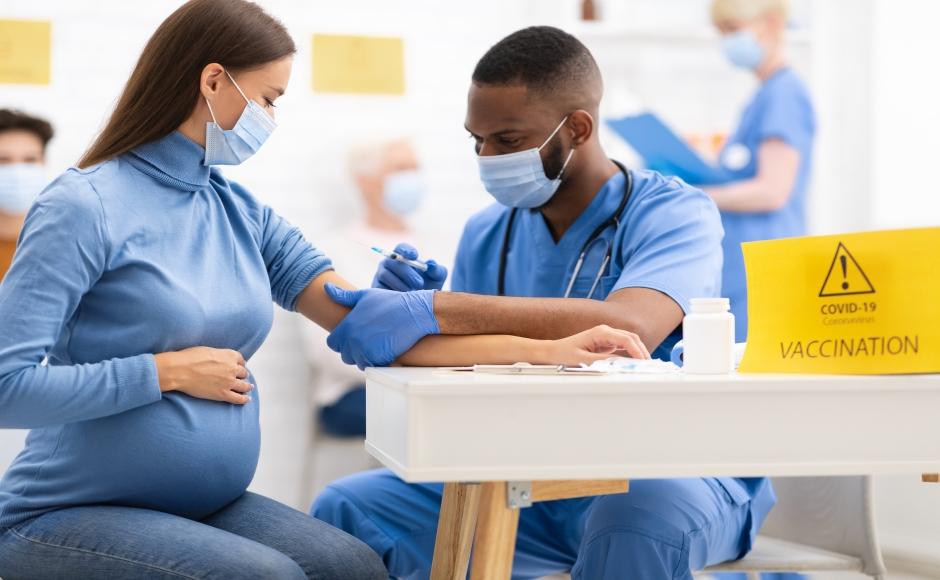 Covid vaccination being administered to a patient