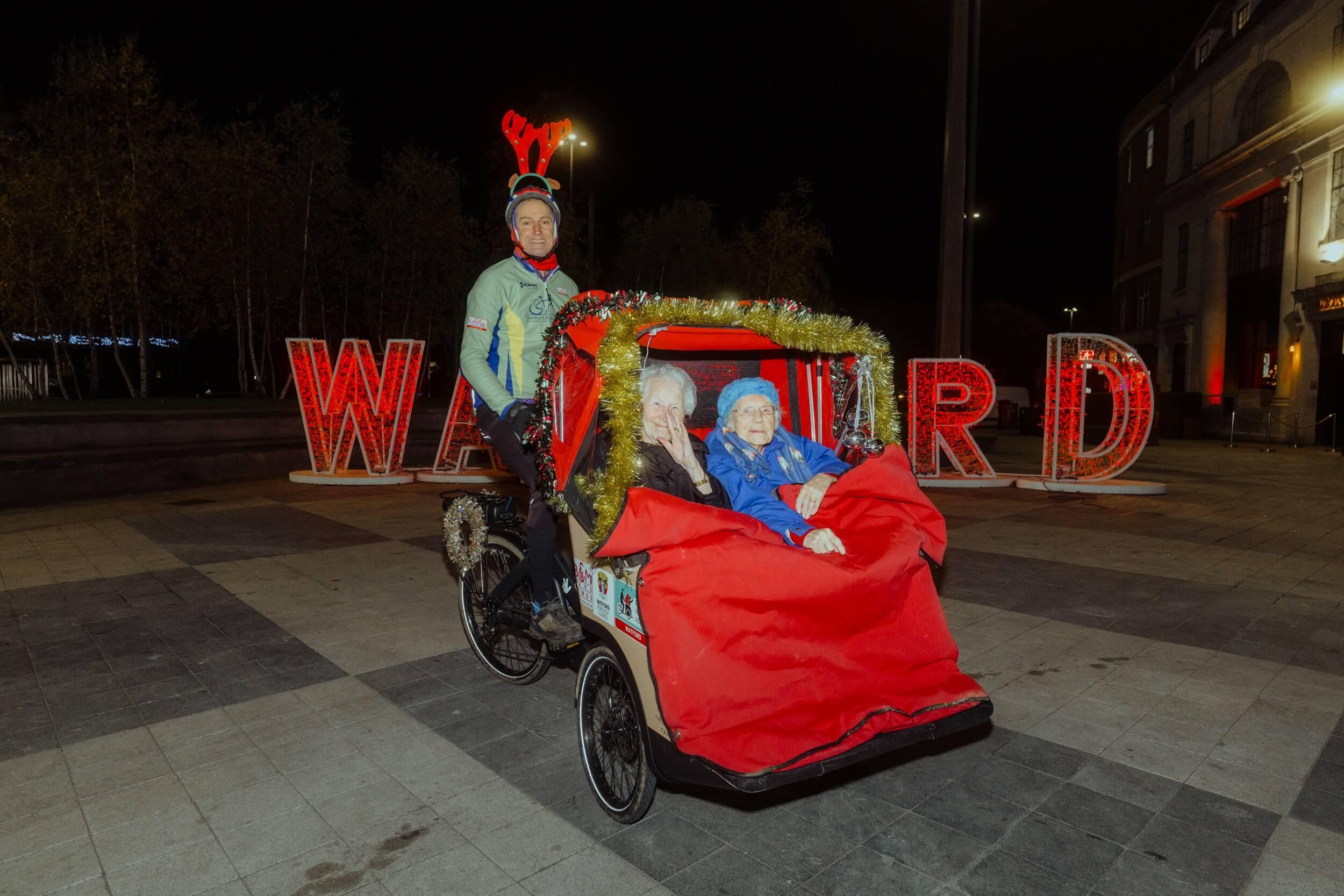 Photo of elderly residents enjoying festive trishaw ride