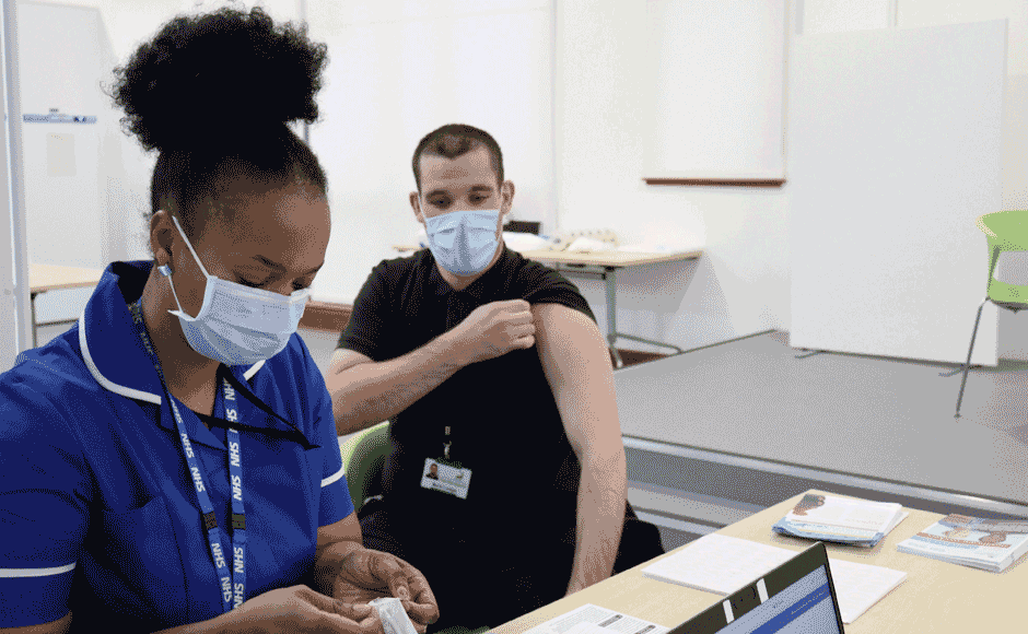A nurse giving a COVID vaccination