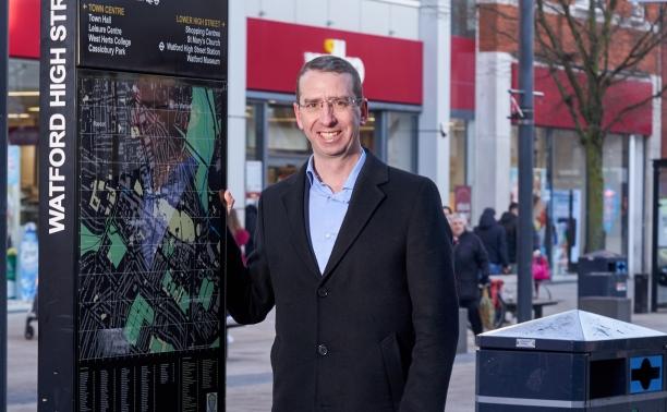 Elected Mayor of Watford, Peter Taylor, by the town centre signs