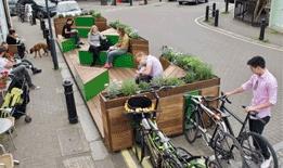 Residents enjoying a new seating area in Watford