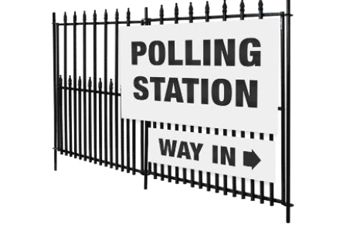 Polling station sign on a gate